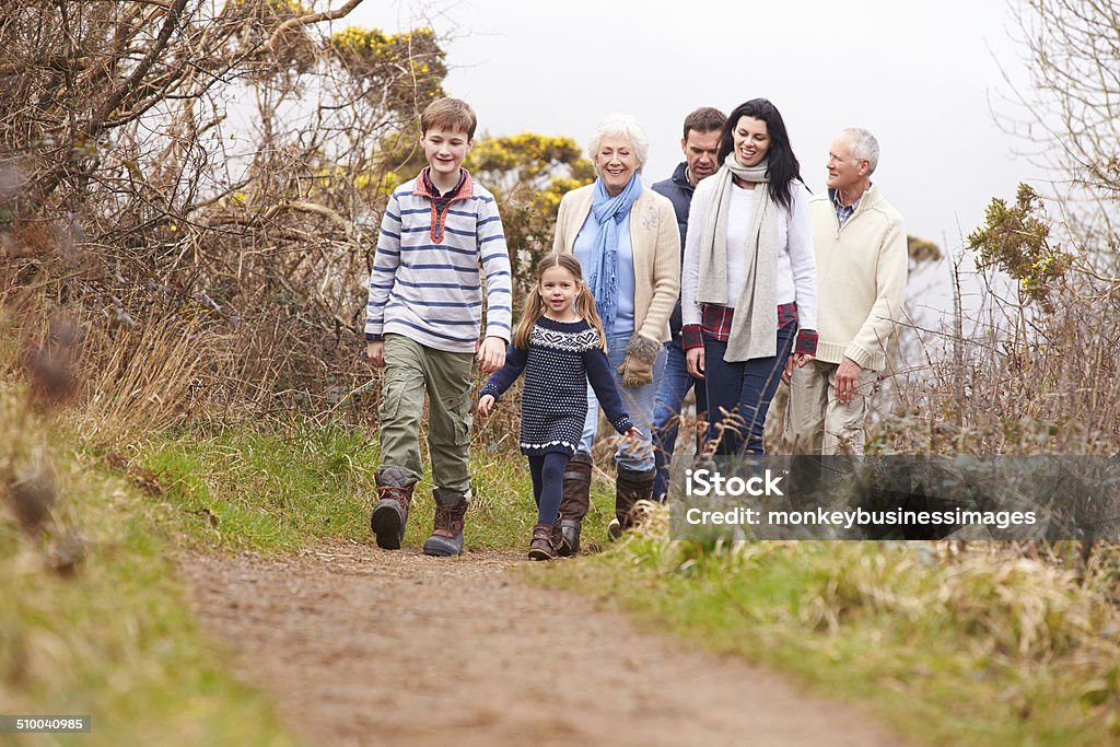 Multi Generation Family On Countryside Walk Multi Generation Family On Countryside Walk Relaxing 30-39 Years Stock Photo