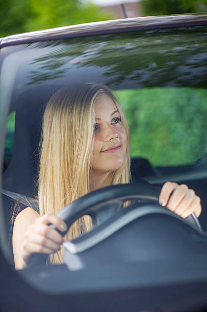 young woman driving her car