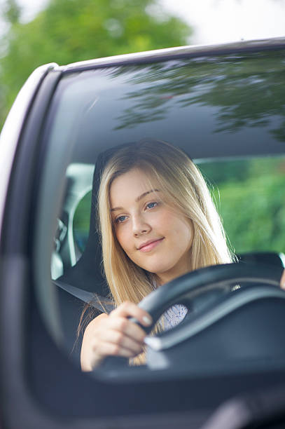 istock young woman driving her car 510041267