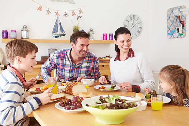 istock Family Eating Lunch At Kitchen Table 510041677