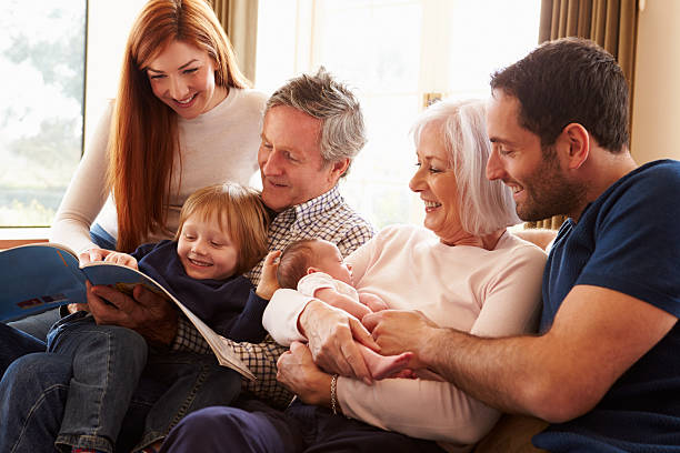 istock Multi Generation Family Sitting On Sofa With Newborn Baby 510042665