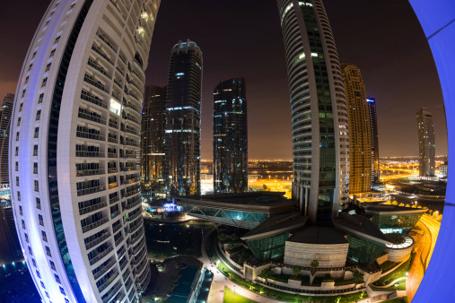 Dubai, United Arab Emirates- March 27, 2014: Residential buildings of Jumeirah Lakes Towers district at night.
