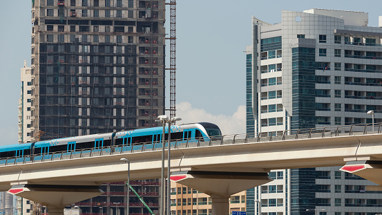 Dubai, United Arab Emirates - March 27, 2014: Train approaching Jumeirah Lakes Tower metro station.