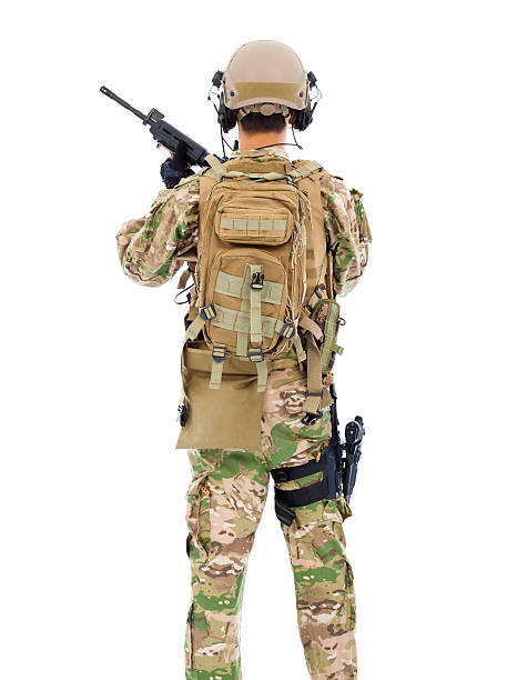 istock back view of soldier with rifle or sniper 510043983