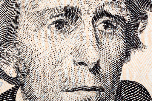 Close up macro image of details on a US $2 bill.