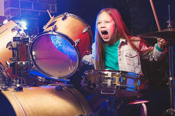 Photo of Girl playing drums