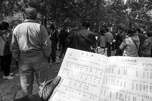 Musician From A Popular Band Playing English Horn During A Religious Procession On Blurred Background