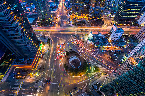 istock Korea,Night traffic speeds through an intersection in Seoul,Kore 510059088
