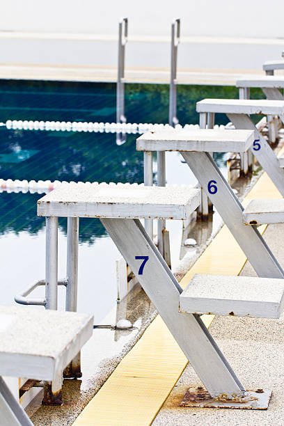 Starting platforms in the swimming pool Starting platforms in the swimming pool jump board stock pictures, royalty-free photos & images