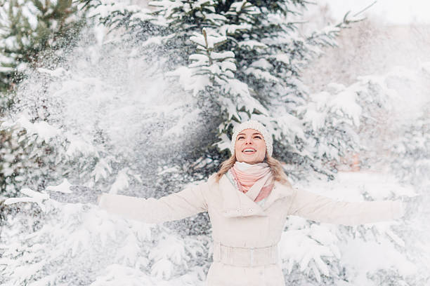 istock Happy young woman playing with snow 510061934