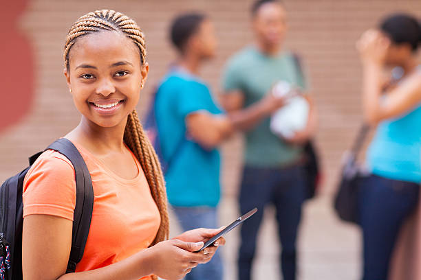 istock afro american college girl with tablet computer 510061995