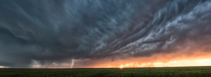 A Supercell thunderstorm on the great plains of USA illuminated at sunset.