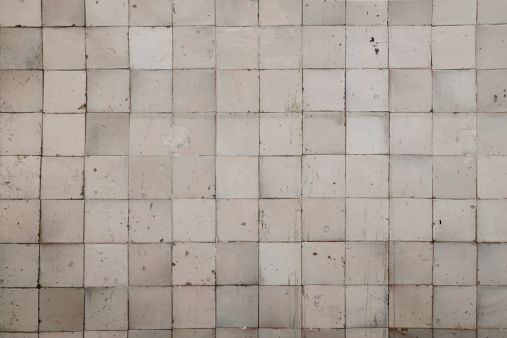 Small square tiles, old and damaged background