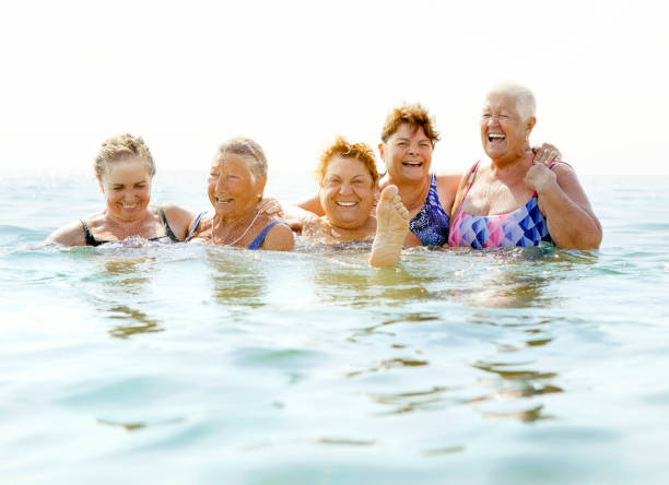 istock Mature ladies laughing on beach 510063502