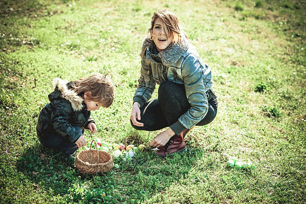 istock Mother and her Little Boy with Easter Eggs outdoors 510063696