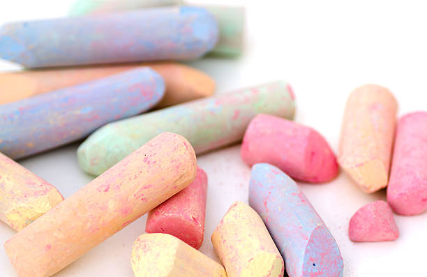 istock Bright pieces of chalk on white background 510064280