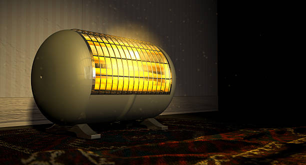 Vintage Heater On Persian Carpet A cylindrical shaped electrical heater illuminated and radiating in an old room on a vintage red persian rug space heater stock pictures, royalty-free photos & images