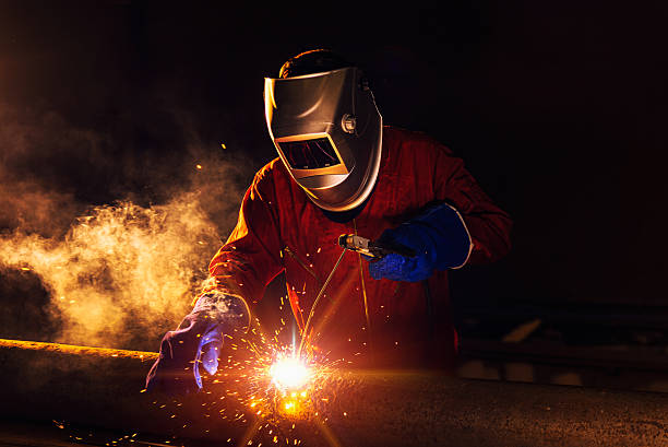 Industrial Worker Industrial Worker at the factory welding closeup metalwork stock pictures, royalty-free photos & images