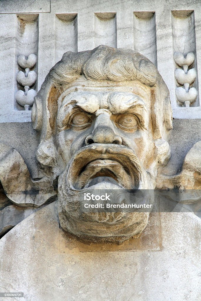 Angry Face A sculpture on the facade of the Grand Palais in Paris. Anger Stock Photo