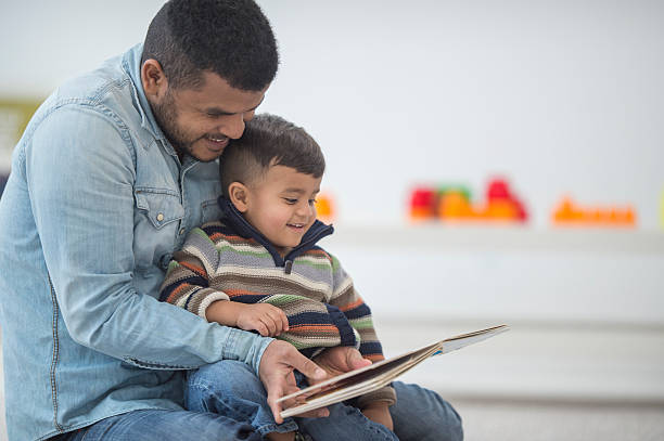 istock Father and Son Reading Books Together 510065250