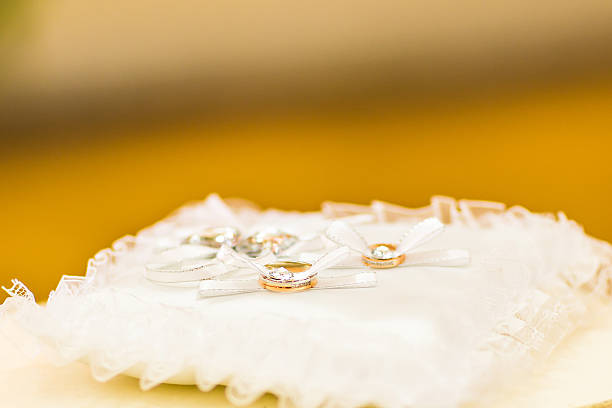 gold wedding rings on the pincushion. Wedding accessories