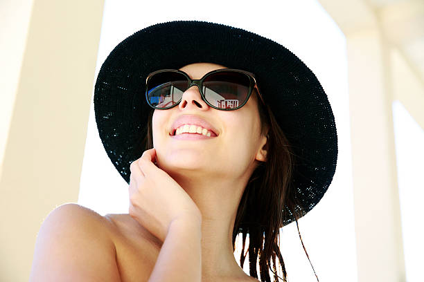 istock cheerful woman in sunglasses and hat 510066169