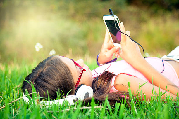istock Listening Music in a meadow 510066271