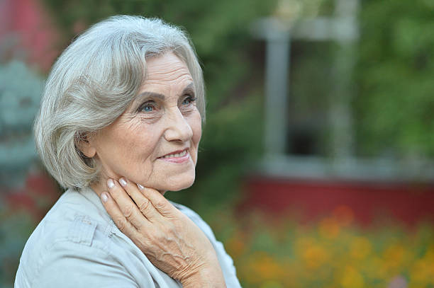 istock senior woman in summer park 510066444
