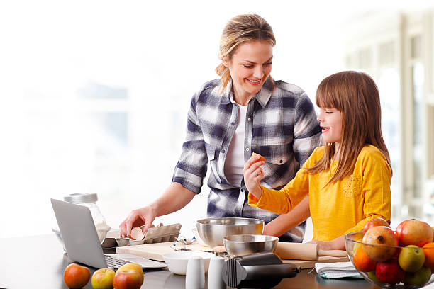 istock Mother and daugther baking together 510066902