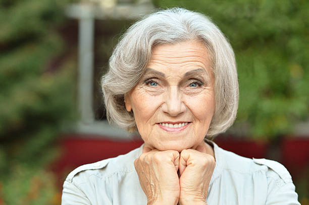 istock senior woman in summer park 510067466