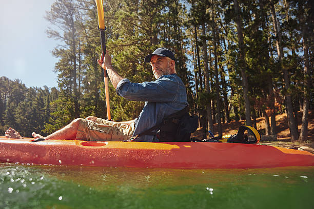 istock Senior man paddling a kayak 510067614