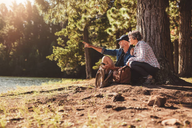 istock Senior man and woman on a hike in nature 510068312