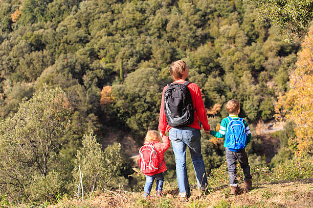 istock father with two kids travel in mountains 510068606