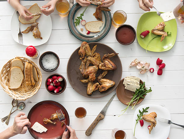 istock family having roasted chicken wings for dinner 510068688