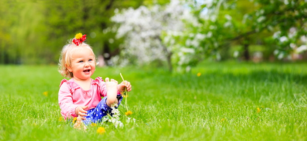 cute happy little girl enjoy spring nature, wide panorama