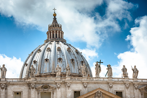 Rome, Italy - June 10, 2013: Facade of st. peter's basilica in Rome inside the Vatican state. Sunny day. St. Peter's Church is the most famous church in Europe.