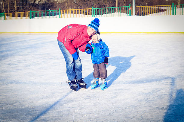 istock little boy skating with parent 510068883