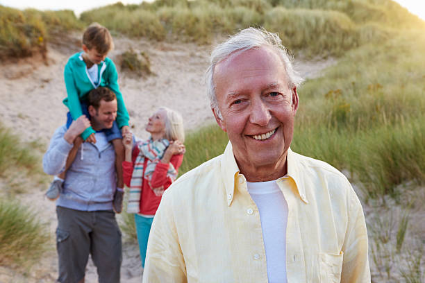 istock Extended Family Group Walking By Sand Dunes 510068970