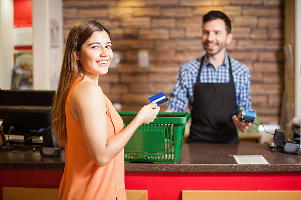 istock Beautiful brunette paying with credit card 510070194