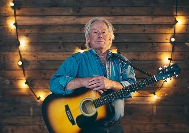 istock Country and western musician standing with guitar. 510073268