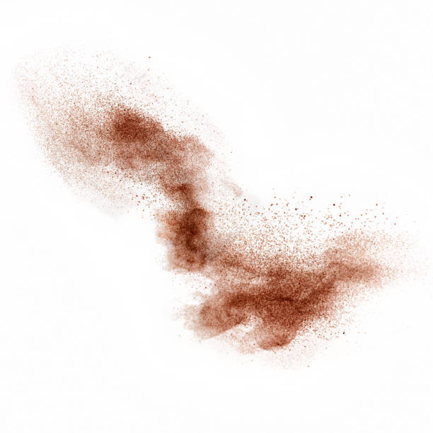 cocoa or coffee powder in motion Coffee or cocoa powder flying , studio shot, selective focus.  ground coffee stock pictures, royalty-free photos & images