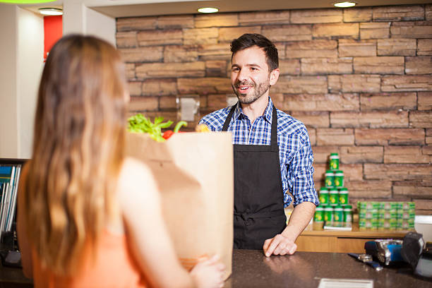 istock Male cashier being friendly to a customer 510076572