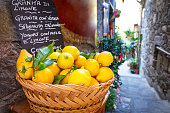 Wicker basket full of lemons on the italian street