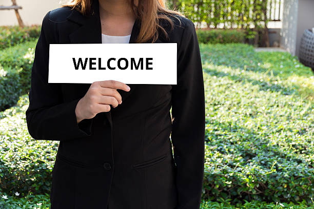 istock Woman showing white sign with welcome word 510082546