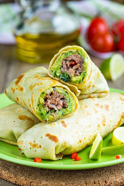istock Pancakes stuffed with avocado sauce, meat beef kebab, Mexican ro 510084502