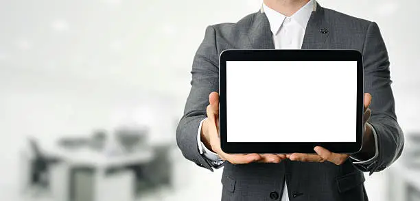 Photo of businessman holding blank digital tablet with copy space