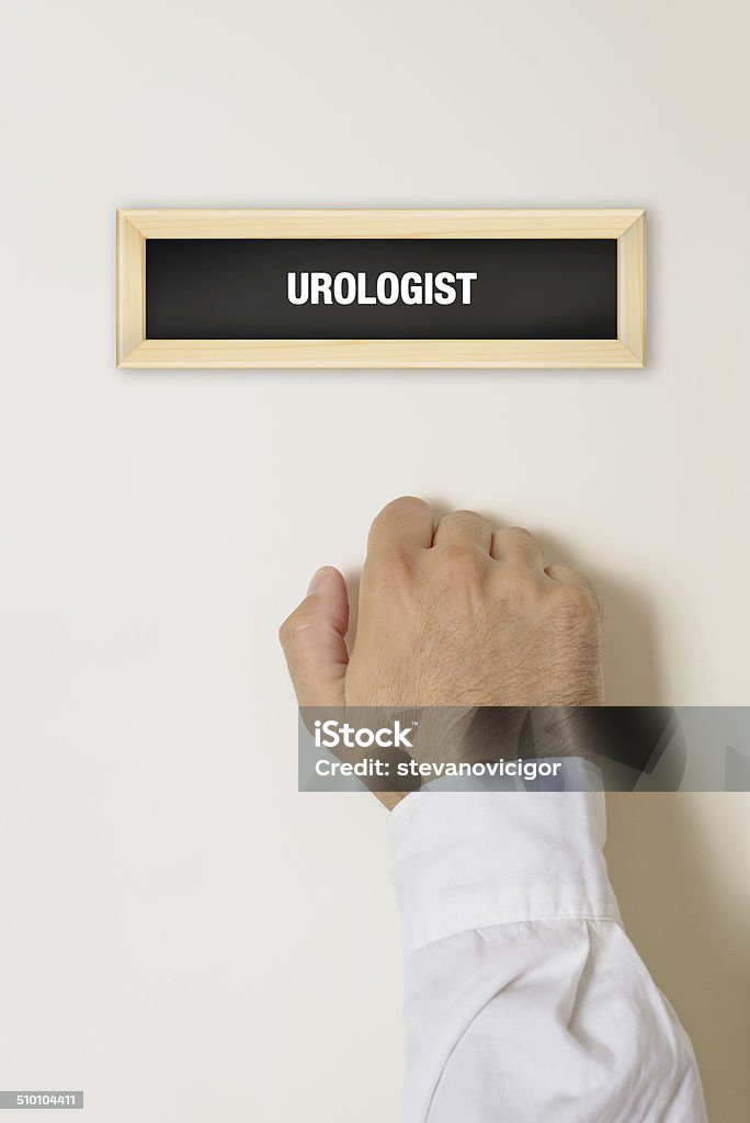 Male patient knocking on Urologist door Male patient knocking on Urologist door for a medical exam. Medical Exam Stock Photo
