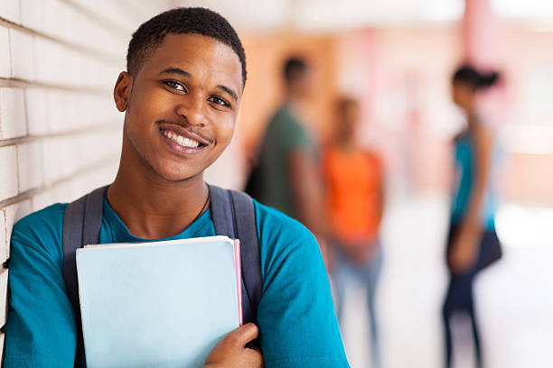istock afro american university student holding books 510105633