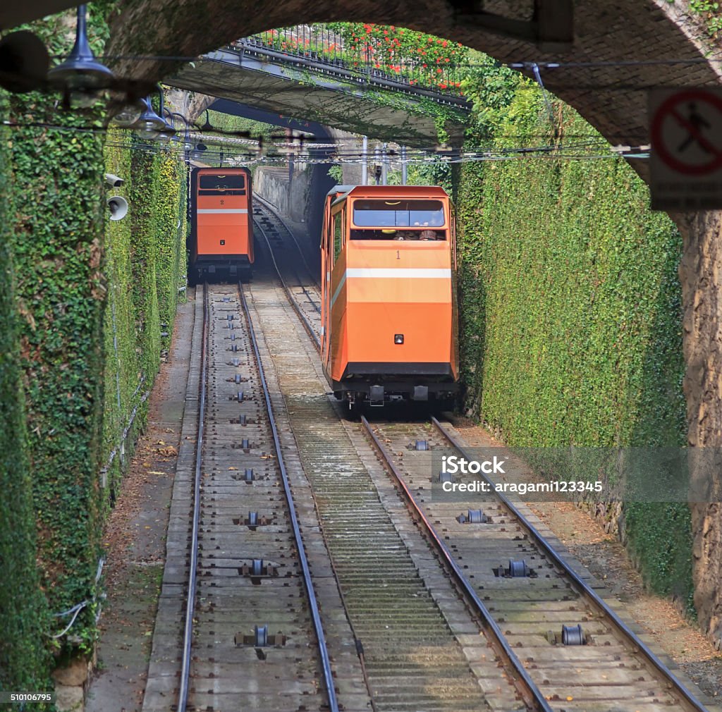 Two funiculars moving on the railroad Two funiculars moving on the railroad in Bergamo, Italy Bergamo Stock Photo