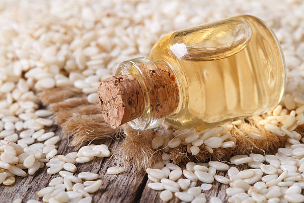 istock sesame seed oil in glass bottle on the table horizontal 510108093